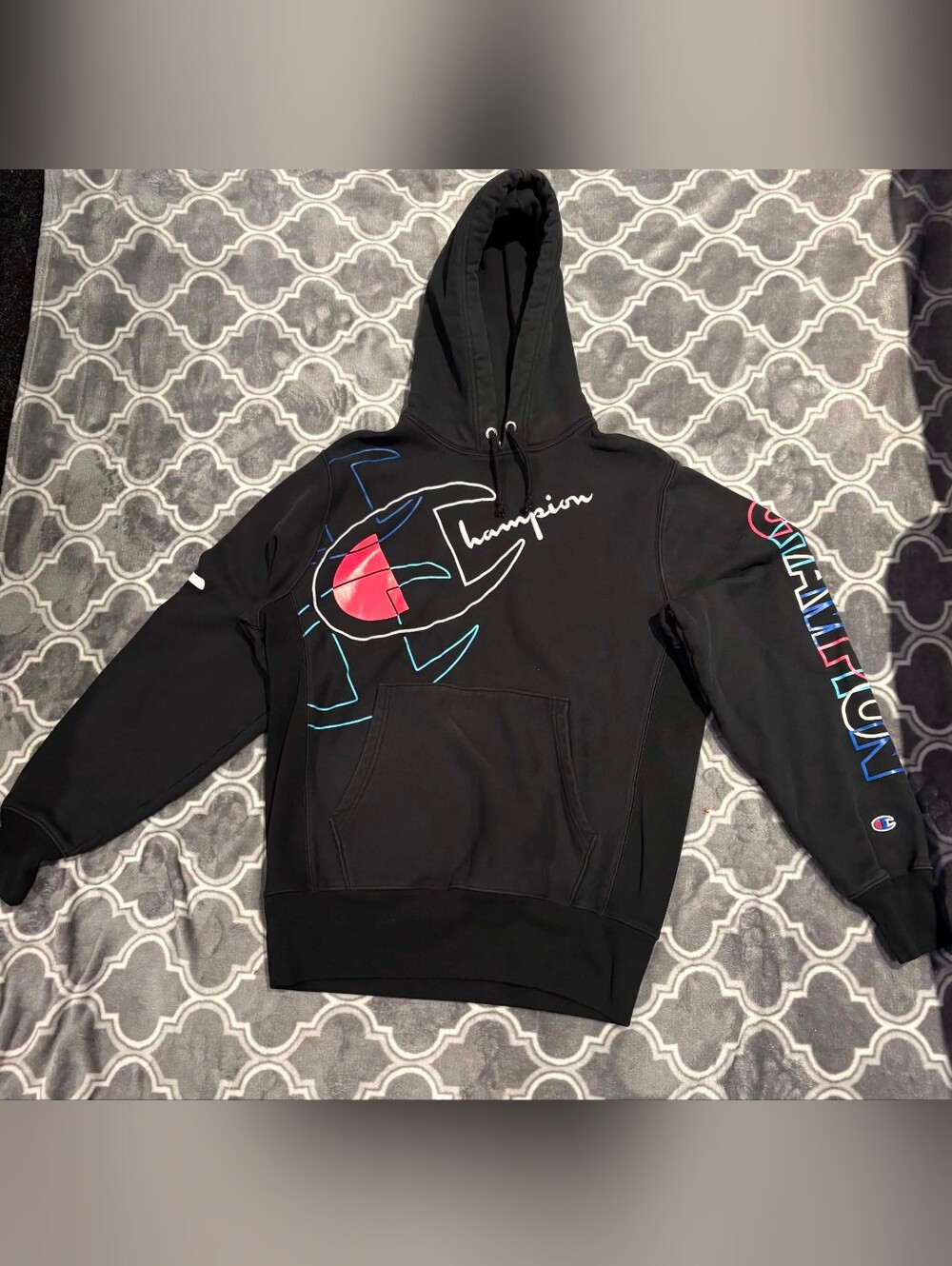 Champion Black Hoodie with Graphic Logo and Red Accent